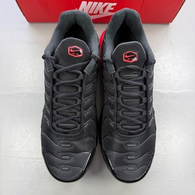 Nike trainers black with blight crimson red accents and signature logo.