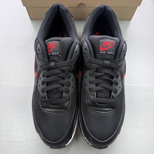 Nike Air Max 90 Jewel trainers black with red and white accents, featuring iconic logo.