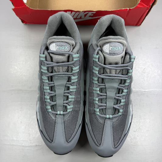 Nike running shoes grey with big bubble sole and logo detailing.