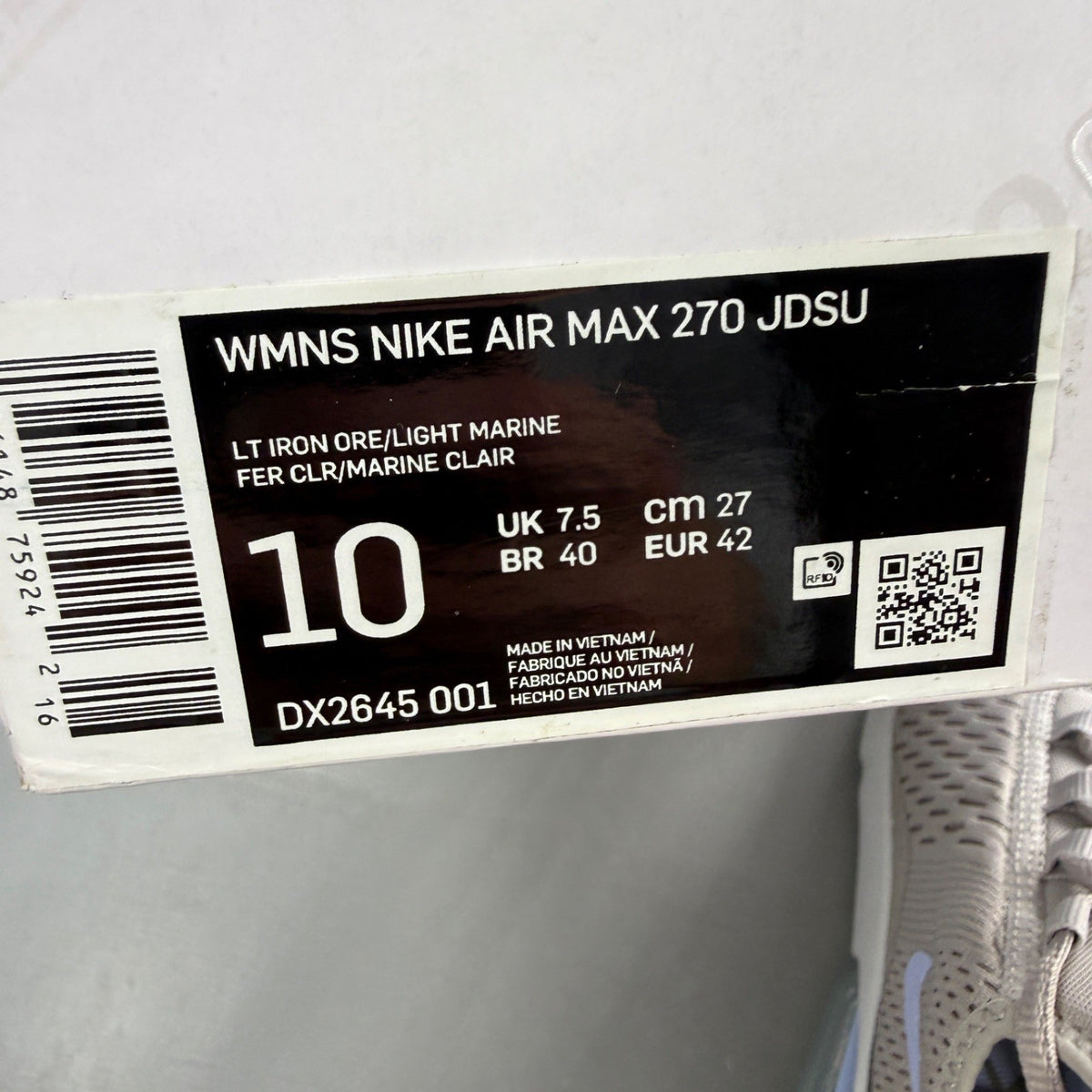 Nike grey trainers with Air Max cushioning and logo detail on the tongue.