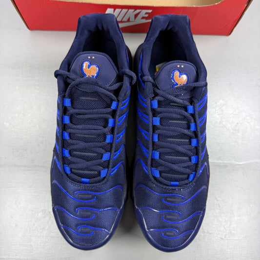 Nike running shoes metallic blue with copper accents and signature logo.