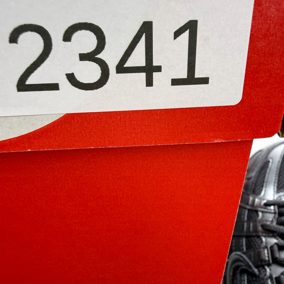Nike black trainers with mesh upper and signature swoosh logo.