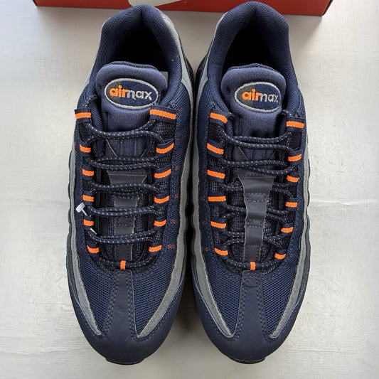 Nike Air Max 95 trainers navy blue with orange accents and anthracite grey details.