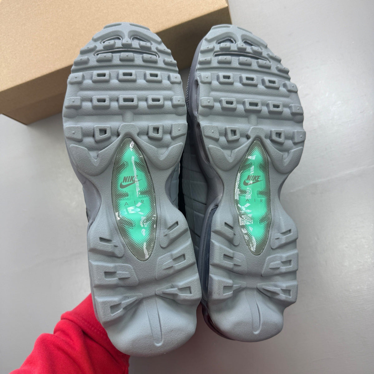 Nike running shoes grey with black accents and signature logo on the side.
