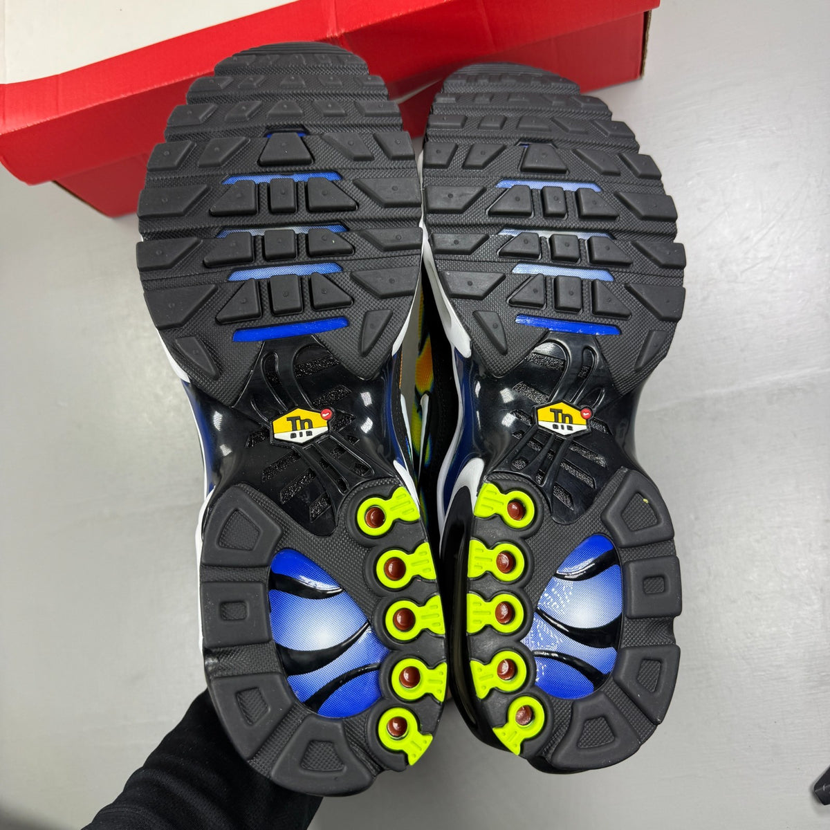 Nike athletic shoes yellow with heat map pattern and black accents.