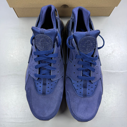 Nike running shoes blue with mesh upper and signature logo detail.