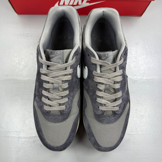 Nike grey deck shoes with premium crepe sole and subtle branding details.