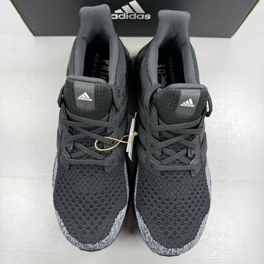 Adidas black Ultra Boost 1.0 trainers with core black and oreo toe design.