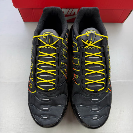 Nike black trainers with Tuned Air technology and sunrise pattern accents.