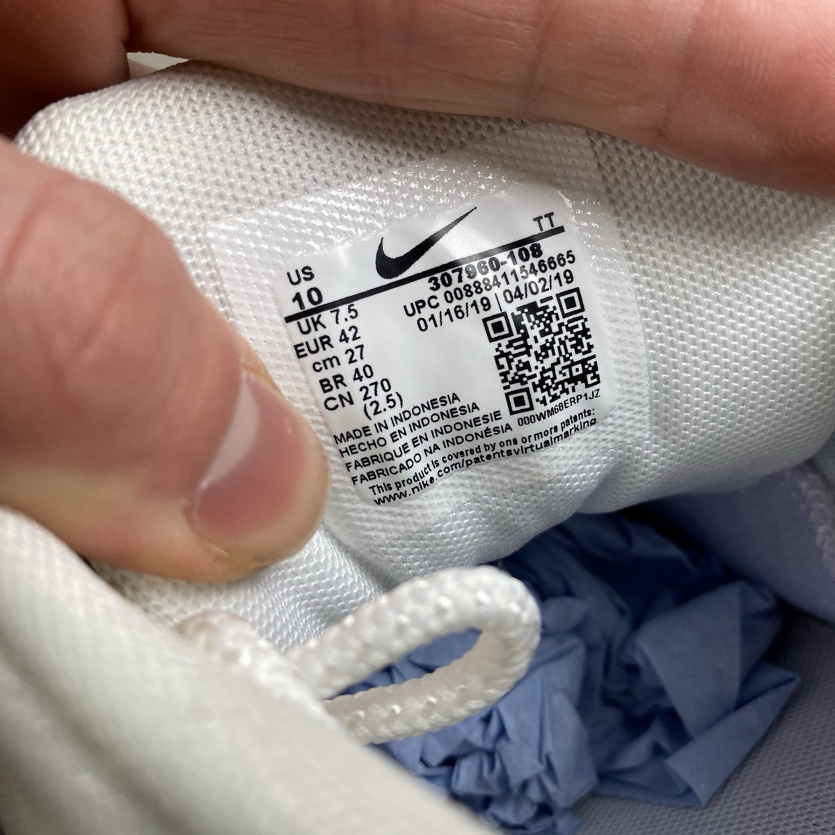 Nike Air Max 95 trainers white mesh upper with signature swoosh logo and layered design.