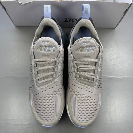 Nike grey trainers with Air Max cushioning and subtle logo detailing.
