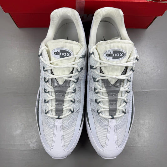 Nike running shoes white with grey accents and Air Max cushioning design.