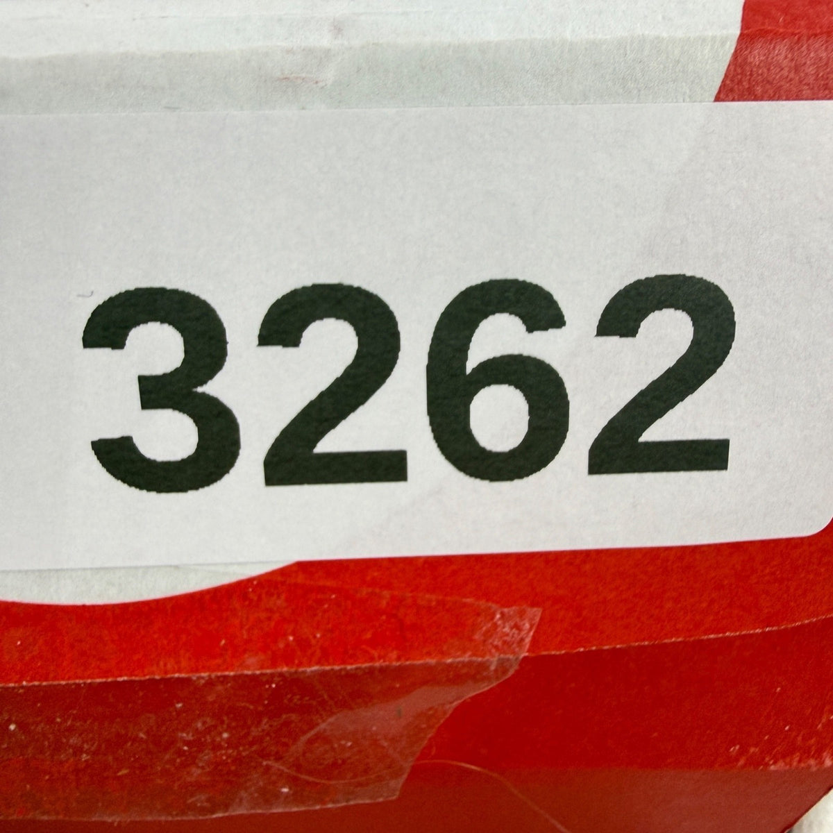 Nike white athletic shoes with Air Max Plus TN design and visible logo details.