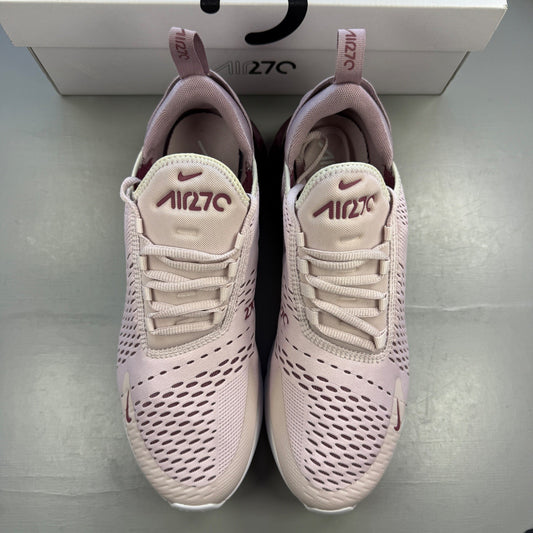 Nike trainers barely rose pink with white accents and Air Max cushioning.