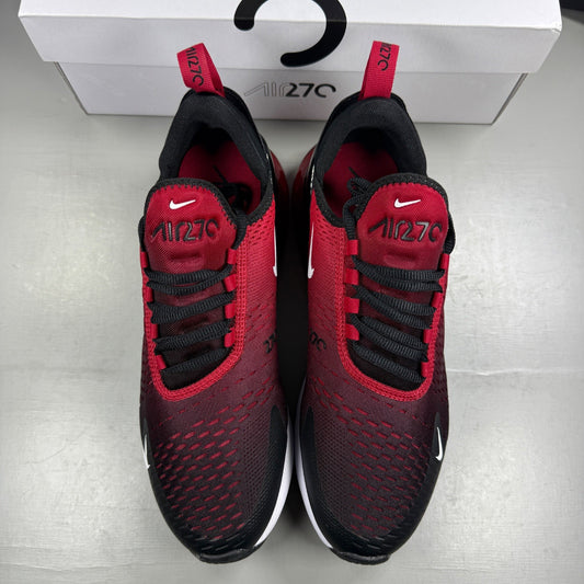 Nike trainers red with black and white accents, featuring Air Max cushioning and logo.