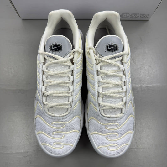 Nike Air Max Plus TN white trainers with unique design elements and logo details.
