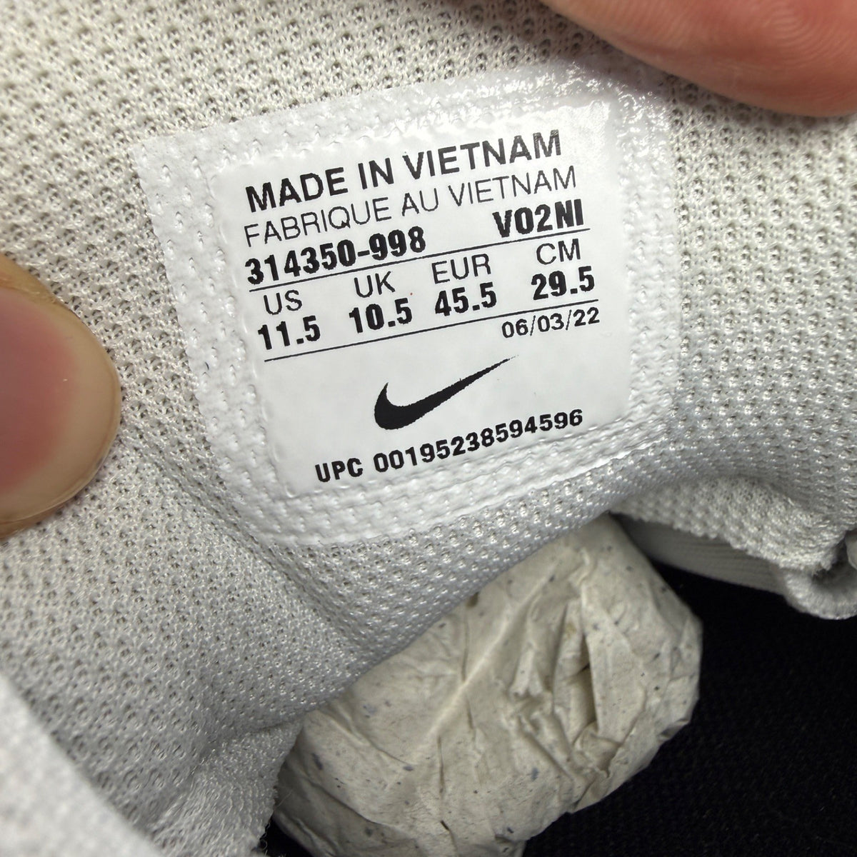 Nike running shoes white with green accents and distinctive Air Max cushioning.