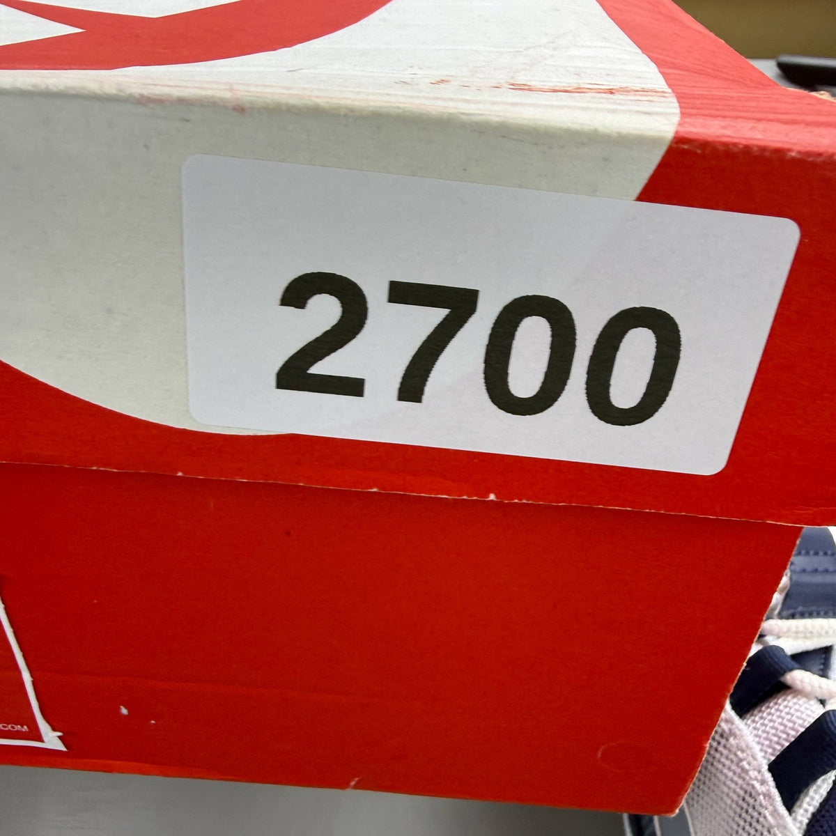 Nike Air Max 95 white trainers with midnight navy and laser orange accents.