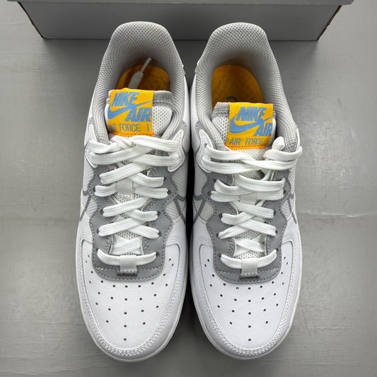 Nike Air Force 1 React white trainers with smoke grey accents and logo details.