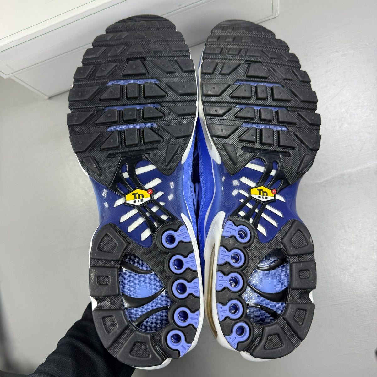 Nike running shoes blue with signature logo and textured mesh upper.