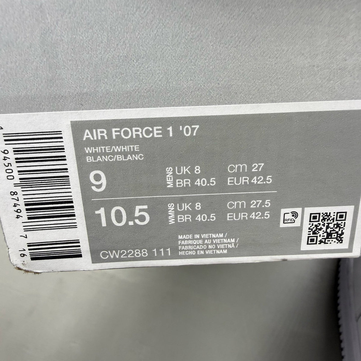 Nike Air Force 1 '07 white trainers with classic silhouette and embossed logo.