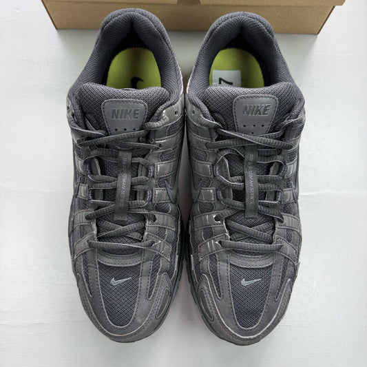 Nike black trainers with reflective detailing and logo on the side.