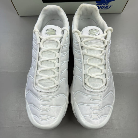 Nike Air Max Plus TN white trainers with metallic silver accents and grey detailing.