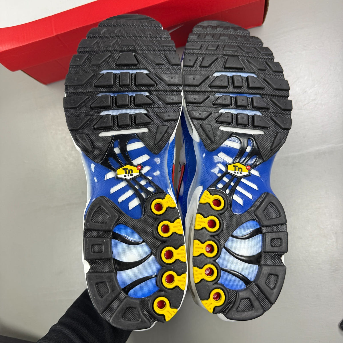Nike running shoes white with Signal Blue accents and Air Max cushioning.