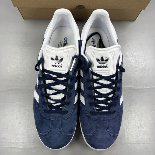 Adidas blue suede trainers with white stripes and logo detailing.