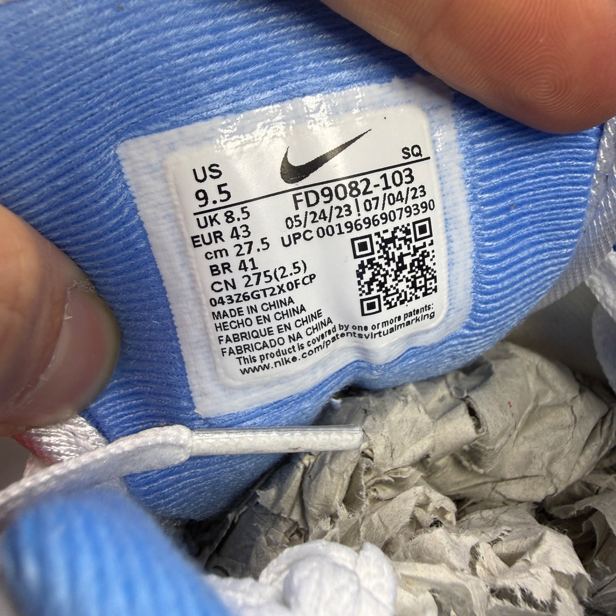 Nike running shoes blue with white accents and Air Max cushioning.