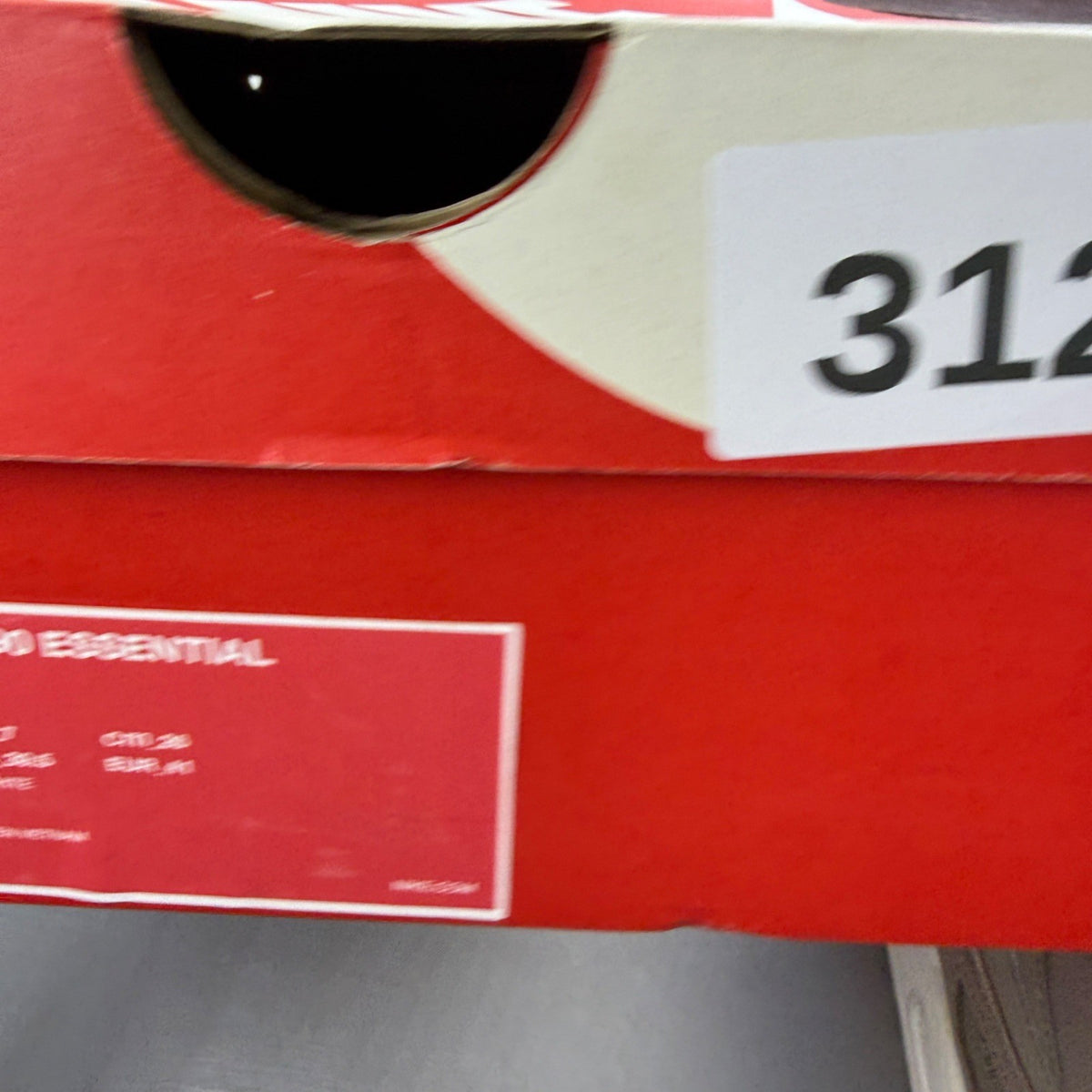 Nike beige trainers with Air Max cushioning and logo detailing.