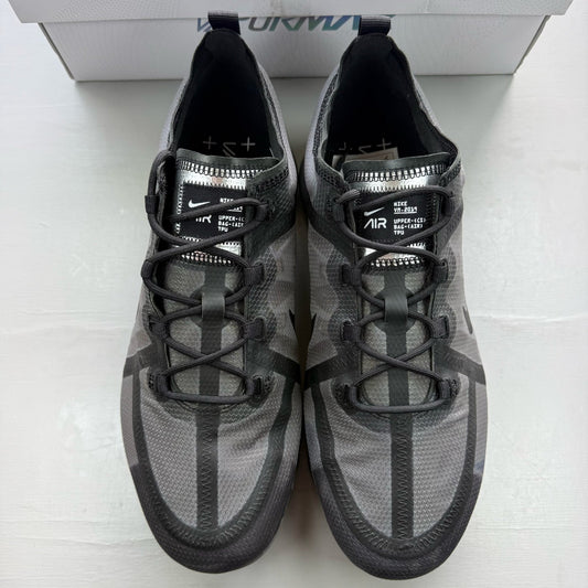 Nike Air VaporMax 2019 black trainers with distinctive air cushioning and sleek design.