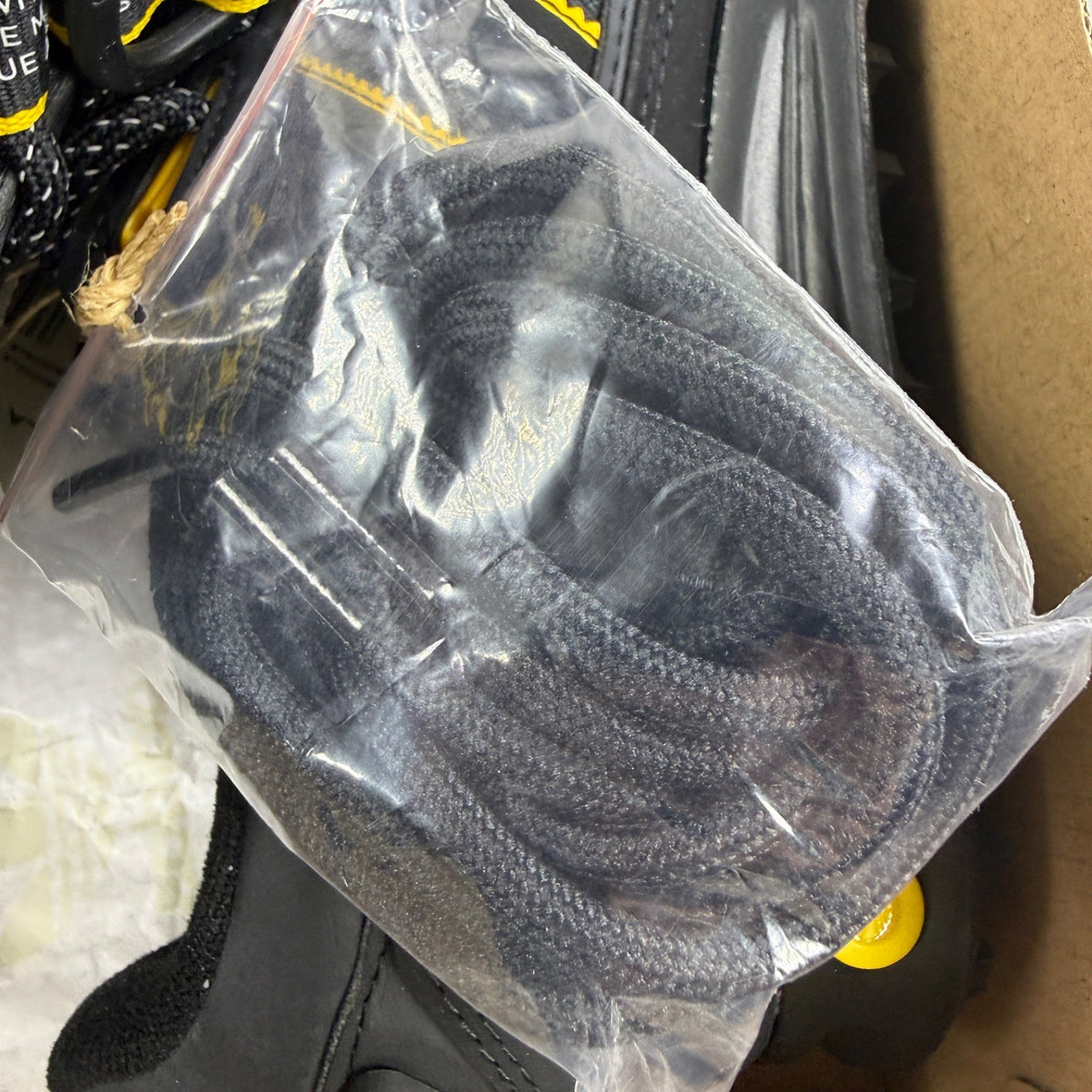 Adidas black deck shoes with gold accents and classic three-stripe logo.