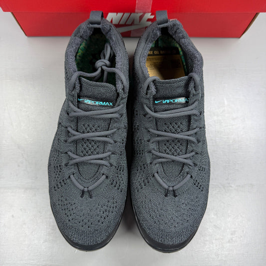 Nike athletic shoes grey Flyknit upper with Air VaporMax sole and logo detail.