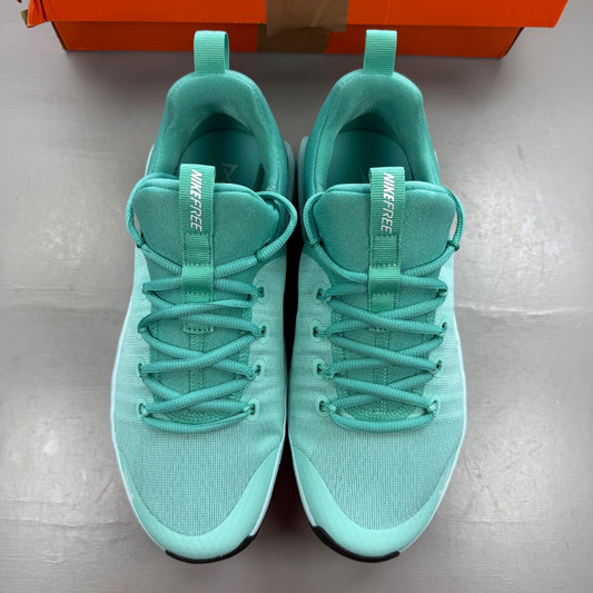 Nike white trainers with bleached turquoise accents and logo detail.