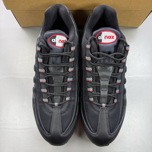 Nike Air Max 95 black trainers with red accents and signature big bubble sole.