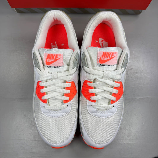 Nike trainers white with hyper orange accents and grey detailing, featuring iconic swoosh logo.