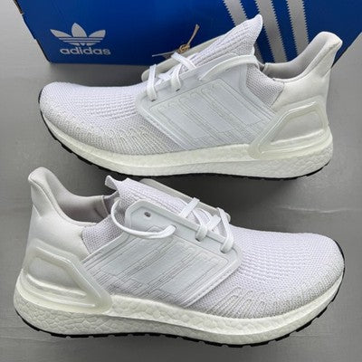 Adidas white trainers with mesh upper and signature three stripes logo.