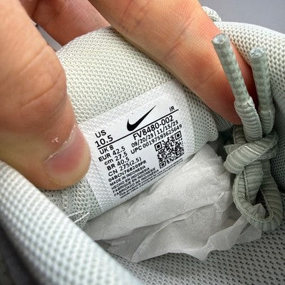 Nike Air Max trainers light silver with distinctive air cushioning and sleek design.