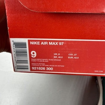 Nike trainers orange with rainforest accents and Air Max cushioning design.
