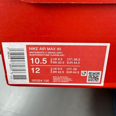 Nike trainers white with smoke grey accents and signature swoosh logo.