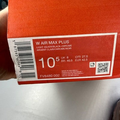 Nike Air Max trainers light silver with distinctive air cushioning and sleek design.