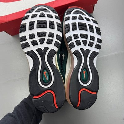 Nike trainers orange with rainforest accents and Air Max cushioning design.