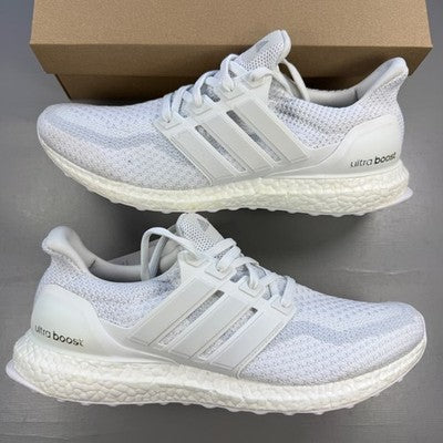 Adidas white trainers with mesh upper and Boost cushioning technology.