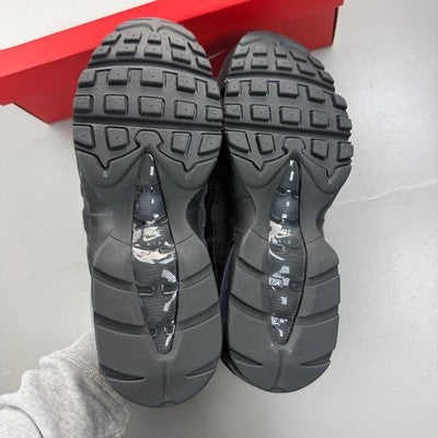 Nike black trainers with grey accents and iconic Air Max bubble sole.