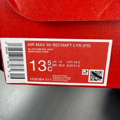 Nike Air Max 95 black red trainers with signature logo and mesh detailing.