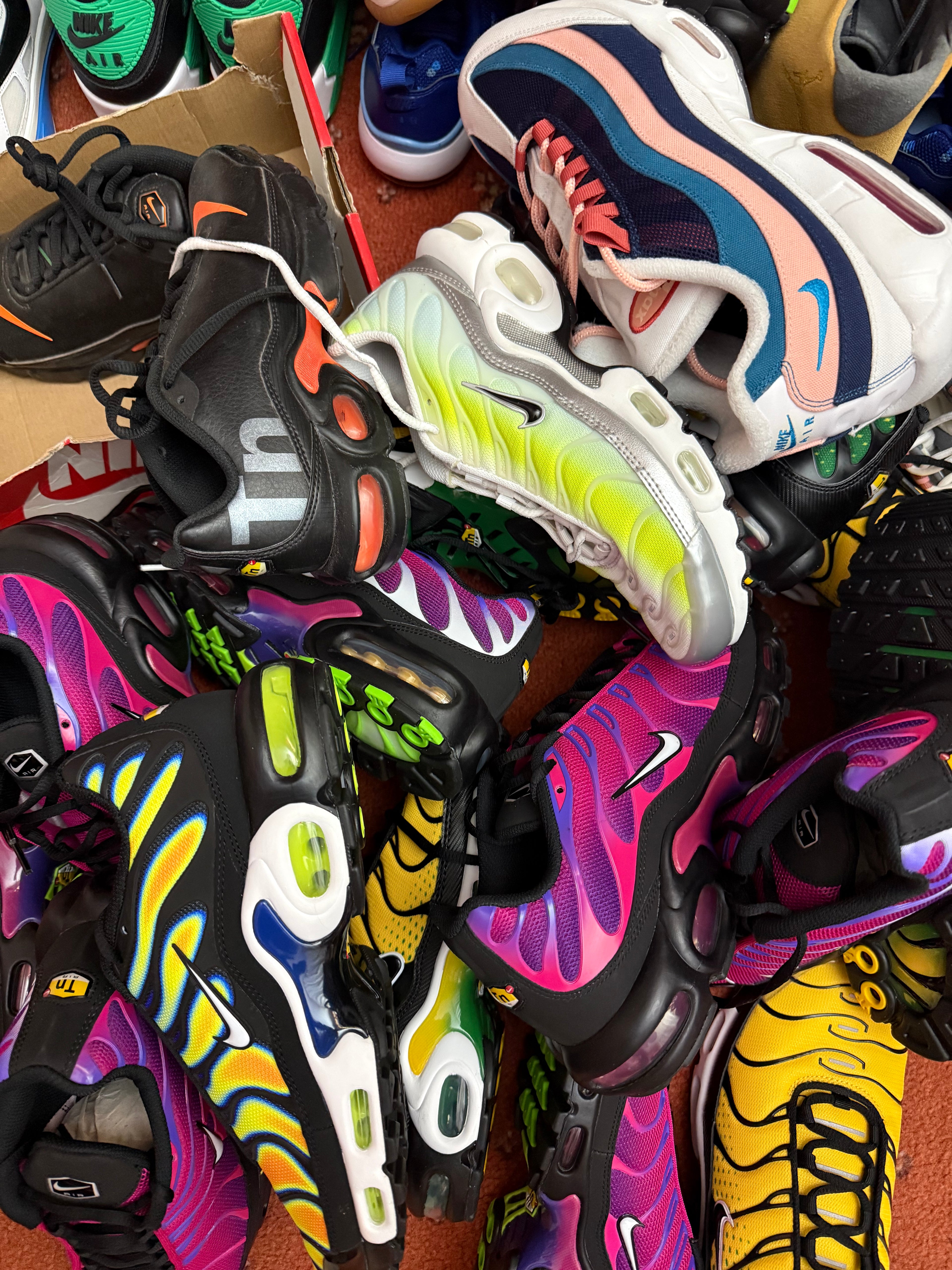 Pile of authentic Nike Air Max Plus TN and Air Max 95 trainers in stock at Dee's Trainers UK