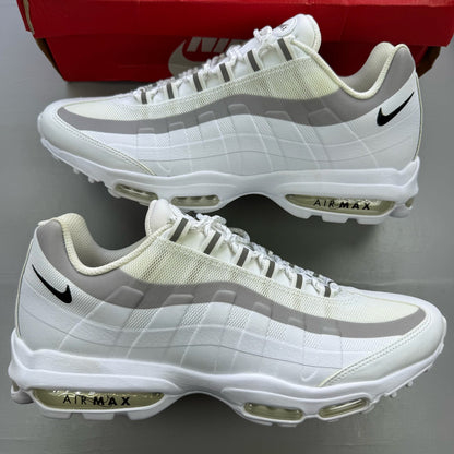 Nike Air Max 95 Ultra white trainers with reflective details and signature logo.