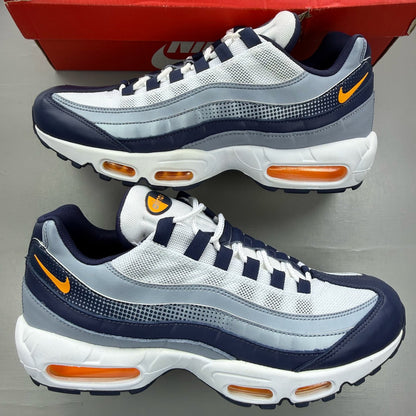 Nike Air Max 95 white trainers with midnight navy and laser orange accents.