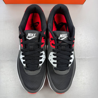 Nike trainers black with infrared accents and grey detailing, featuring Air Max cushioning.